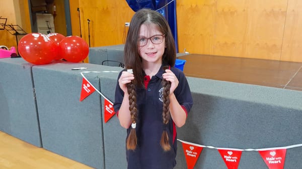 Brave schoolgirl snips her locks for kids in need
