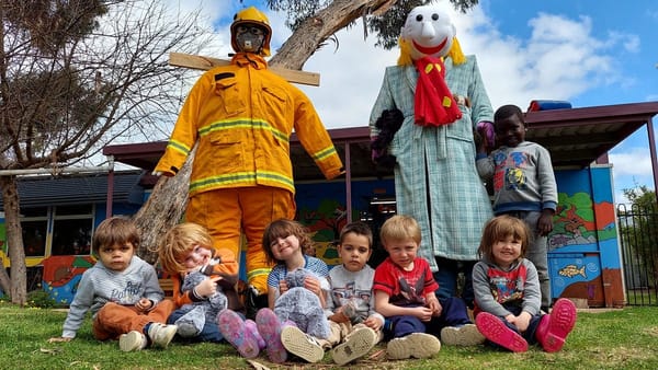 Fraser Park kids jump at a dingle dangle scarecrow challenge