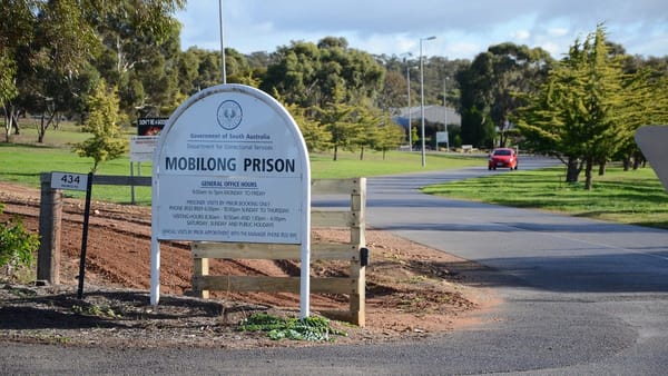 Prison officer arrested at Mobilong